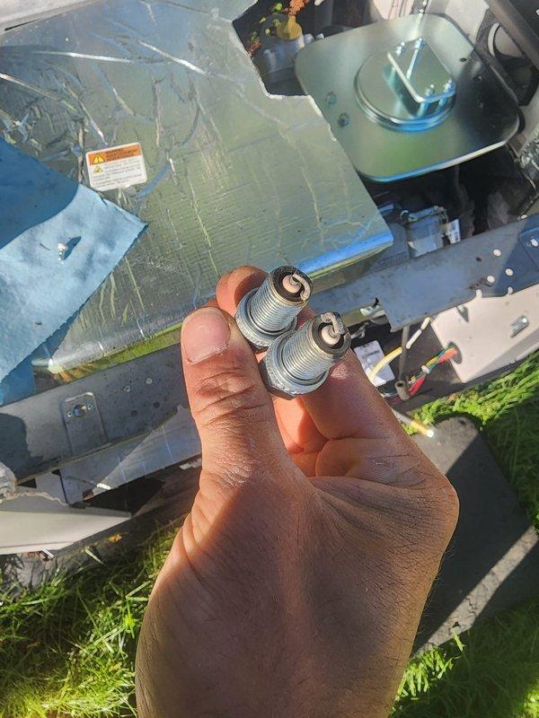 Completed scheduled generator maintenance including removal and replacement of worn spark plugs, inspection of internal components, and cleaning of air filtration system. Unit was opened, all mechanical and electrical connections were verified for proper operation, and equipment was returned to service in good working condition.