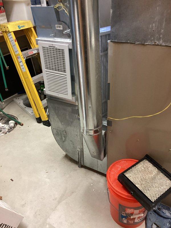 Provided comprehensive estimate for complete HVAC system replacement including both air conditioning and furnace units for 28-year-old equipment that has reached end of service life. The existing AC unit is non-operational while the furnace remains functional but requires replacement due to age and efficiency concerns. Assessed basement-located furnace with vertical ductwork configuration and exterior-mounted condenser unit positioned on concrete pad against brick exterior wall, documenting equipment specifications and installation requirements for proposed system upgrade.