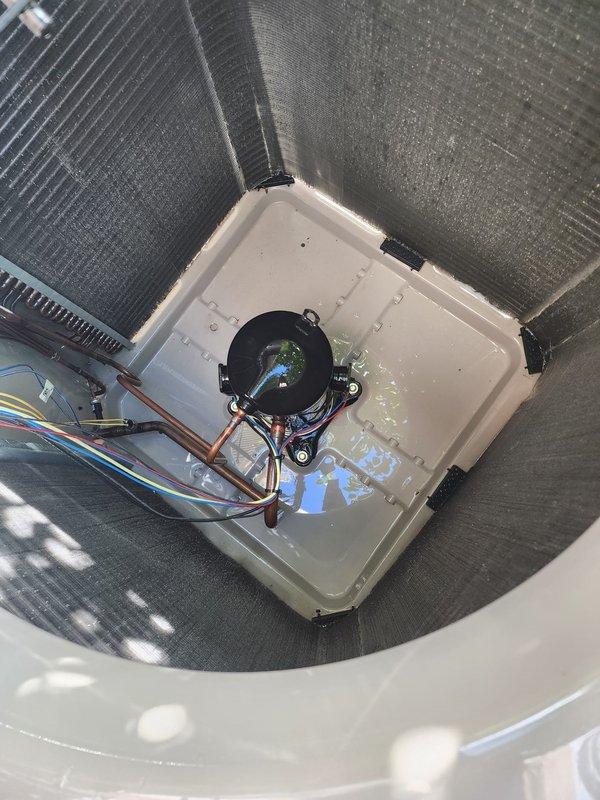 Completed comprehensive cooling system maintenance and tune-up on residential HVAC unit. Performed thorough inspection of outdoor condenser unit, verified proper operation of compressor and fan motor, cleaned condenser coils and protective mesh grilles, and confirmed adequate airflow through unit. Inspected indoor air handler components including evaporator coil assembly, condensate drain pan, and condensate pump system. Verified proper drainage, checked refrigerant lines for leaks and proper insulation, and tested all electrical connections and controls. Added condensate treatment tablets to drain pan to prevent algae growth and maintain clear drain lines. System tested and confirmed operating within normal parameters with no issues identified. All safety devices functioning properly and unit cycling correctly.