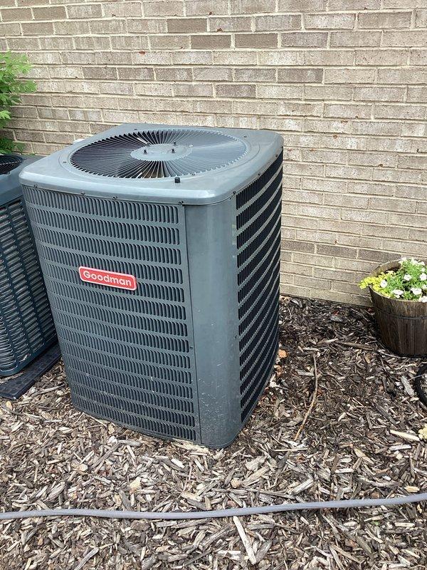 Provided estimate for replacement of 4-year-old air conditioning system experiencing cooling failure and out of warranty. Evaluated existing Goodman and Evcon outdoor condenser units located on exterior of residence against brick wall, both installed on mulch beds. Documented equipment conditions and discussed replacement options with homeowner during scheduled appointment window.
