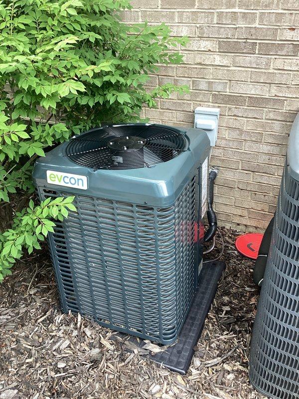 Provided estimate for replacement of 4-year-old air conditioning system experiencing cooling failure and out of warranty. Evaluated existing Goodman and Evcon outdoor condenser units located on exterior of residence against brick wall, both installed on mulch beds. Documented equipment conditions and discussed replacement options with homeowner during scheduled appointment window.
