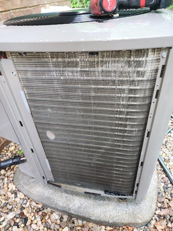 Completed annual cooling maintenance inspection on residential air conditioning system as part of Worry Free Service Agreement. Performed comprehensive system evaluation including condenser unit inspection, noting accumulated debris on coil fins requiring attention, and interior component assessment revealing rust formation on base pan and age-related corrosion on metal surfaces. Customer renewed maintenance agreement during service visit.