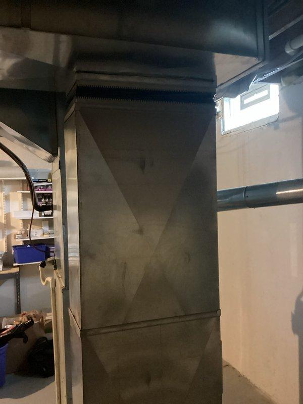 Provided comprehensive replacement estimates for 25-year-old HVAC system including multiple options: air conditioning unit and furnace combination, air conditioning unit only, and air conditioning with high-efficiency furnace upgrade. Current air conditioning system diagnosed with failed compressor requiring replacement, while existing furnace remains operational. Equipment located in basement utility area with metal ductwork and adequate access for installation.