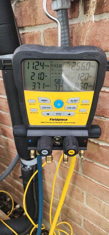 Performed routine cooling system maintenance on residential air conditioning unit. Connected digital manifold gauges to verify system pressures and temperatures, with readings indicating proper refrigerant charge and system operation. Inspected condenser coil and noted moderate accumulation of dirt and debris between fins that will require monitoring for optimal heat transfer efficiency.