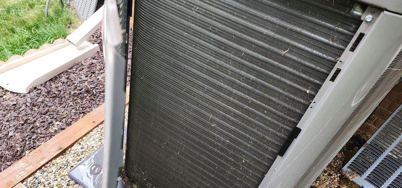 Performed routine cooling system maintenance on residential air conditioning unit. Connected digital manifold gauges to verify system pressures and temperatures, with readings indicating proper refrigerant charge and system operation. Inspected condenser coil and noted moderate accumulation of dirt and debris between fins that will require monitoring for optimal heat transfer efficiency.