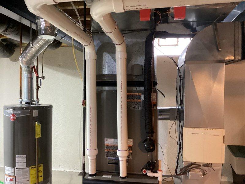 Successfully installed new Lennox furnace system with zone damper in residential basement mechanical room. Installation included proper venting with PVC piping, electrical connections, and integration with existing HVAC infrastructure. All equipment tested and operational, with system ready for heating season.