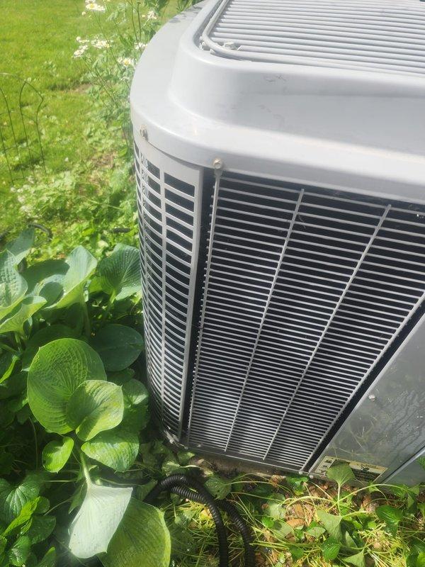 Responded to no cooling complaint on 25-year-old residential air conditioning system located in backyard. Upon arrival, confirmed unit had complete loss of cooling affecting entire home. Performed visual inspection of outdoor condenser unit, which showed significant age-related wear consistent with equipment at end of service life. Removed top grille to access internal components and inspected condenser fan motor, capacitor, electrical connections, and compressor. Found unit had reached maximum expected lifespan with multiple components showing deterioration from extended outdoor exposure and normal operational wear. Documented equipment condition with photos showing exterior housing, internal components, wiring, and motor assembly. Given the age of the system at 25 years—well beyond the typical 15-20 year lifespan of residential AC equipment—recommended full system replacement rather than repair. Advised that investing in repairs on equipment of this age would not be cost-effective, a