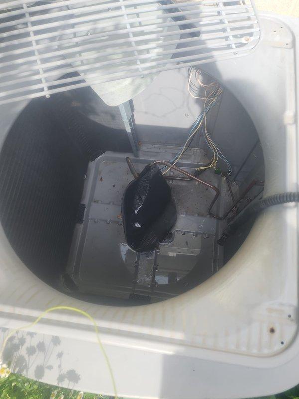 Responded to no cooling complaint on 25-year-old residential air conditioning system located in backyard. Upon arrival, confirmed unit had complete loss of cooling affecting entire home. Performed visual inspection of outdoor condenser unit, which showed significant age-related wear consistent with equipment at end of service life. Removed top grille to access internal components and inspected condenser fan motor, capacitor, electrical connections, and compressor. Found unit had reached maximum expected lifespan with multiple components showing deterioration from extended outdoor exposure and normal operational wear. Documented equipment condition with photos showing exterior housing, internal components, wiring, and motor assembly. Given the age of the system at 25 years—well beyond the typical 15-20 year lifespan of residential AC equipment—recommended full system replacement rather than repair. Advised that investing in repairs on equipment of this age would not be cost-effective, a