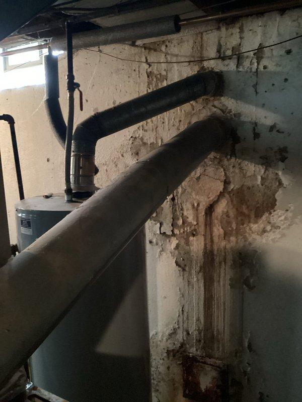 Completed estimate for furnace replacement on 30+ year old Ruud unit with failing blower motor exhibiting extremely weak performance and imminent failure risk. Non-functional furnace switch also documented during assessment. Provided replacement options to address aging equipment and component failures in basement mechanical room installation.