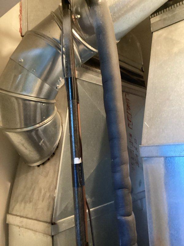 Provided comprehensive estimate for complete air conditioning system replacement at front of condominium unit. Existing equipment over 20 years old and non-operational, requiring full system change-out including outdoor condensing unit, indoor air handler, refrigerant lines, and associated ductwork connections. Assessed current installation including existing duct configuration, drain line routing with PVC condensate piping, electrical supply requirements, and equipment placement constraints in confined mechanical space.