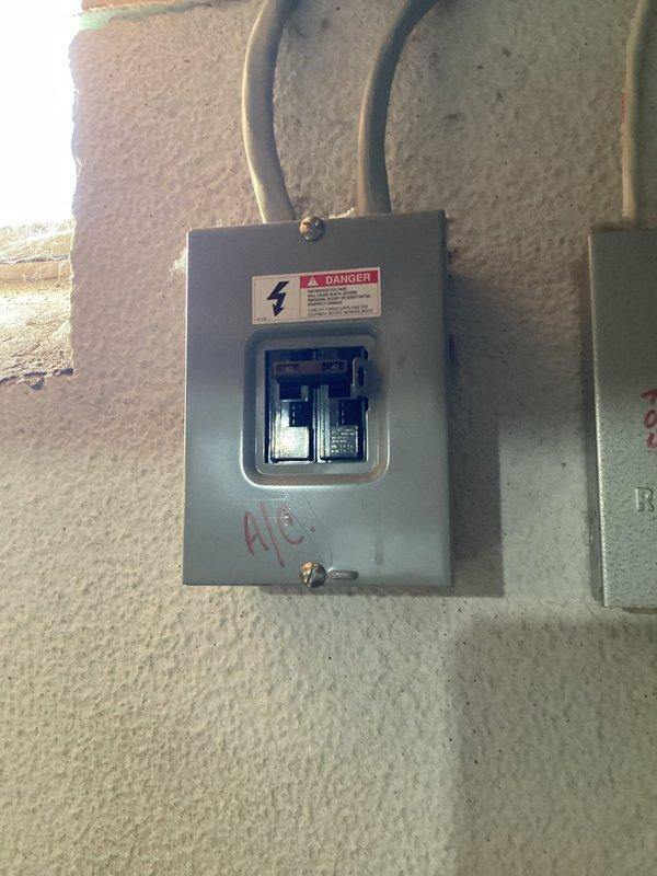 Conducted comprehensive HVAC system replacement estimate at residential property. Evaluated existing electrical infrastructure including outdoor disconnect box with dual circuit breakers and main electrical panel in basement utility area. Documented current equipment configuration, electrical service capacity, conduit routing, and panel accessibility for proposed system installation. Photographed all relevant components to support equipment sizing recommendations and replacement scope development.