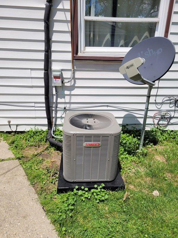 Completed full HVAC system installation including Lennox 80% efficiency gas furnace, air conditioning condenser unit, whole-home humidifier, and T6 programmable thermostat. Outdoor condenser unit was positioned on rubber isolation pad with proper clearances from structure, connected refrigerant lines, and electrical supply established. Indoor furnace installed in closet space with complete ductwork connections, PVC condensate drainage system, fresh air intake piping, and humidifier integration into supply plenum. Thermostat wired and programmed for system operation. All electrical connections completed to code, refrigerant lines pressure tested and charged to manufacturer specifications, and system startup performed with verification of proper heating and cooling operation.