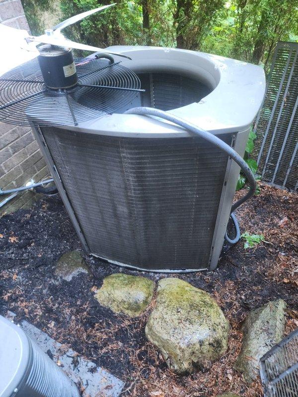 Completed routine preventative maintenance on residential air conditioning system and furnace per customer request. Performed comprehensive AC tune-up including visual inspection of outdoor condenser unit, verified proper operation of condenser fan motor, inspected condenser coil fins for debris and damage, checked refrigerant line connections for signs of leakage, and assessed overall system condition. Unit showed normal wear consistent with age, with minor surface oxidation visible on internal mounting components. Condenser coil and fan assembly operating within normal parameters. Completed furnace inspection and tune-up procedures on approximately 10-year-old heating system. No operational issues identified on either system during service visit.