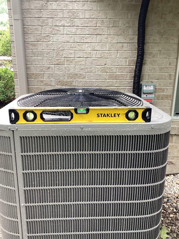 Completed warranty service call addressing two items: plumbing repair coordination and HVAC equipment leveling. Releveled outdoor condensing unit to manufacturer specifications using precision level to ensure proper refrigerant flow, drainage, and optimal system performance. Unit now sits level on pad with stable positioning confirmed.