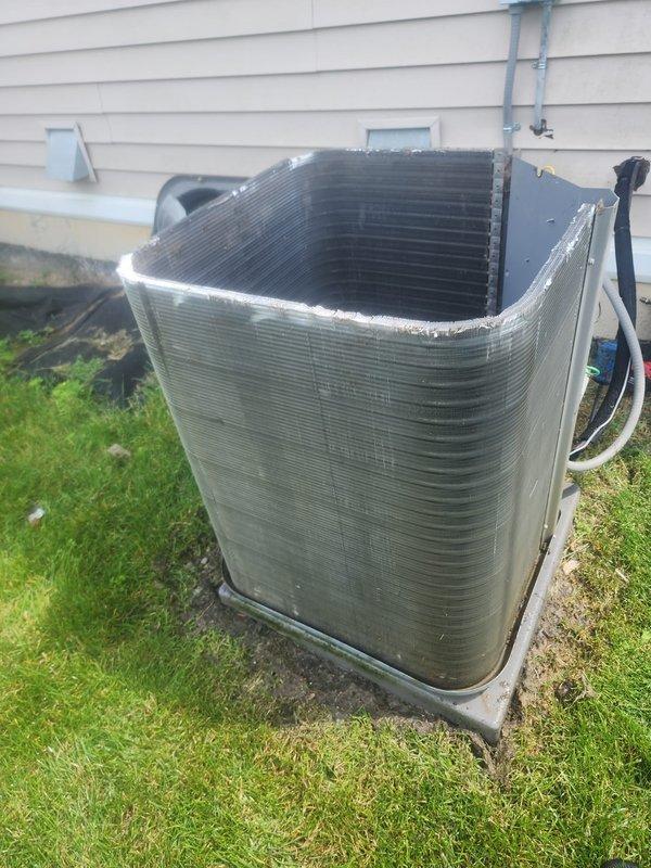 Performed scheduled maintenance on central air conditioning condenser unit. Cleaned accumulated dirt, grime, and debris from exterior fins and coil surfaces to restore proper airflow and heat transfer efficiency. Inspected compressor, electrical connections, and fan assembly; verified system operational with normal heating and cooling function upon completion.