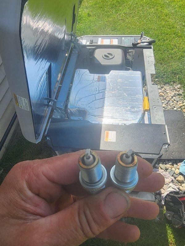 # Generator Maintenance Service

Performed scheduled preventive maintenance on residential standby generator system. Conducted comprehensive inspection of unit including gas valve assembly, electrical connections, and internal components. Removed and inspected spark plugs, which showed normal wear patterns consistent with regular operation. Verified all wire connections including red, blue, and yellow control wiring to gas valve were secure and properly terminated. Inspected external housing and verified unit was properly positioned on concrete pad with adequate ventilation. Checked manufacturer labels and warning placards for visibility and legibility. All systems tested and confirmed operational. Unit returned to service with no deficiencies noted.