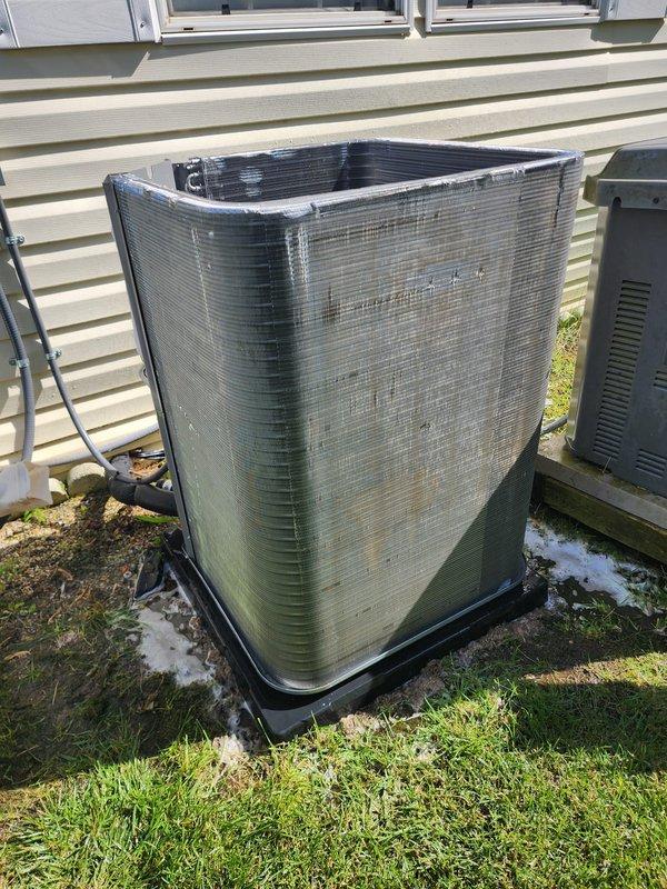 Completed routine cooling season maintenance on outdoor air conditioning condenser unit per Worry Free Service Agreement protocol. Performed comprehensive system inspection including compressor operation, refrigerant line connections, electrical components, and condenser coil condition. Unit exterior showed algae growth and environmental weathering; coils and internal components were inspected and found operational. All electrical connections secure, copper refrigerant lines intact, and compressor functioning properly at time of service.
