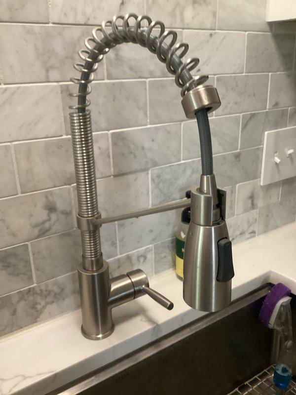 Responded to callback for kitchen sink faucet with no hot water following initial installation. Upon inspection, verified hot water was available at other fixtures throughout the home. Diagnosed and corrected supply line connection issue at the newly installed commercial-style pull-down faucet, restoring proper hot water flow to the kitchen sink and confirming full functionality of the fixture.
