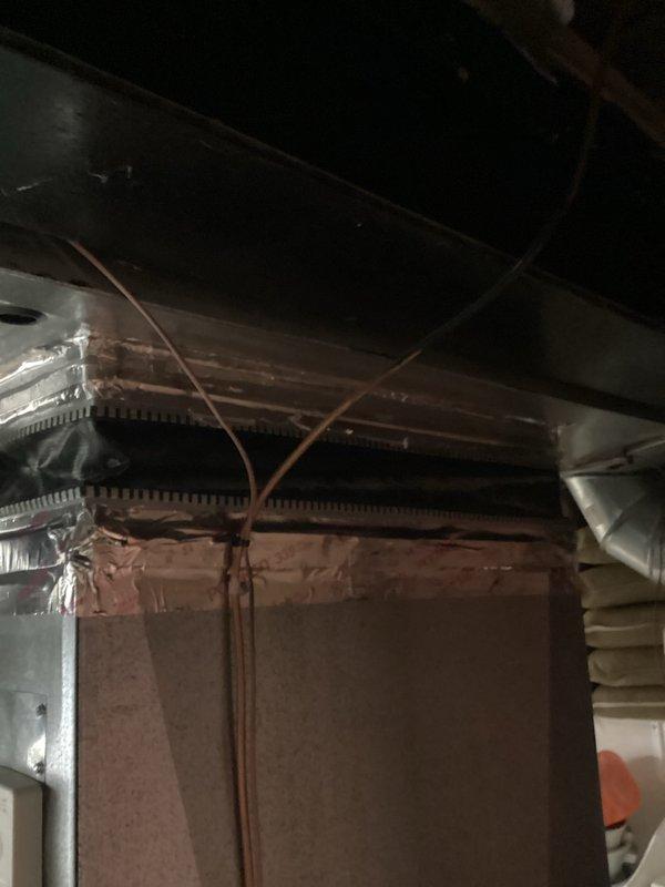Completed warranty follow-up inspection on recently installed HVAC system. Addressed canvas return air duct issue on right side of furnace where material had become compressed against the unit. Documented installation condition through comprehensive photography of furnace interior, including burner assembly, control panel, and ductwork connections, as well as attic space showing flexible ductwork routing and copper line sets. Verified proper clearances and completed required follow-up documentation for warranty records.