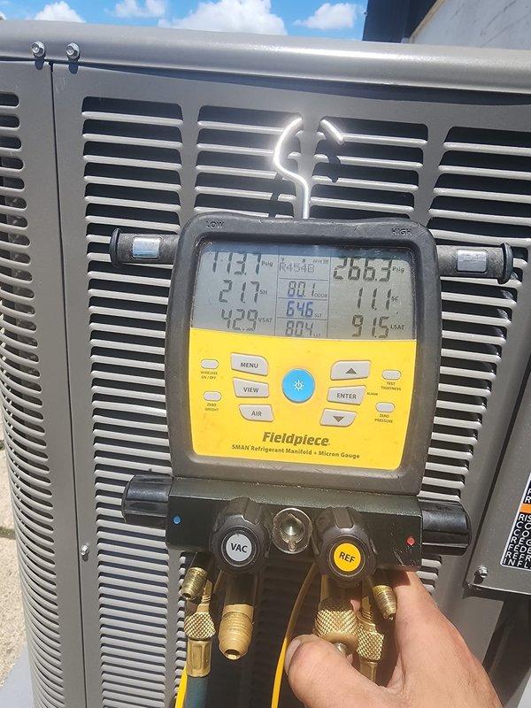 Responded to callback for AC unit not cooling zones 1-5. Upon arrival, performed diagnostic testing of the outdoor condensing unit using refrigerant manifold gauges. Measured system pressures and temperatures to verify operating conditions. Inspected electrical disconnect, conduit connections, and outdoor unit installation. Documented system readings and equipment condition with photos for service records. System evaluated and findings recorded for further action.