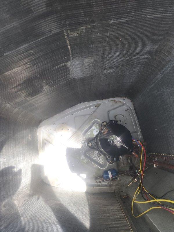 Completed routine air conditioning maintenance on a prepaid service visit. Performed inspection of the evaporator coil, which showed normal condensation and minor dust accumulation on the aluminum fins but remained in functional condition with no damage or significant fouling. Inspected the blower motor assembly inside the air handler unit, verifying proper mounting, electrical connections, and overall operational integrity. All components photographed and found to be operating within normal parameters. System maintenance completed per manufacturer specifications.