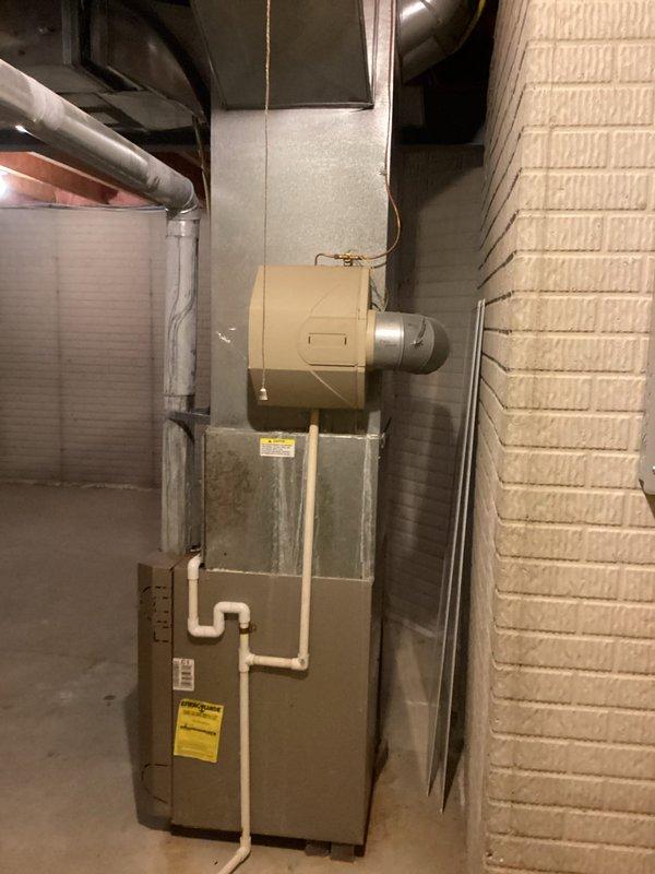 Completed on-site assessment of non-functional HVAC system at rental property for full replacement estimate. Evaluated existing furnace and central air conditioning unit, both originally installed in 2003, confirming equipment failure and end of serviceable life. Inspected basement mechanical room configuration, including existing ductwork, humidifier integration, PVC condensate drainage system, and electrical connections. Documented current system specifications, clearances, and installation conditions through photographic survey. Assessed structural requirements for replacement equipment installation, including adequate access, ventilation, and code compliance considerations. Provided homeowner with comprehensive replacement options focused on standard efficiency equipment suitable for rental property application, emphasizing cost-effective and reliable solutions with manufacturer warranties. Reviewed available utility rebate programs and current promotional offers to maximize value.
