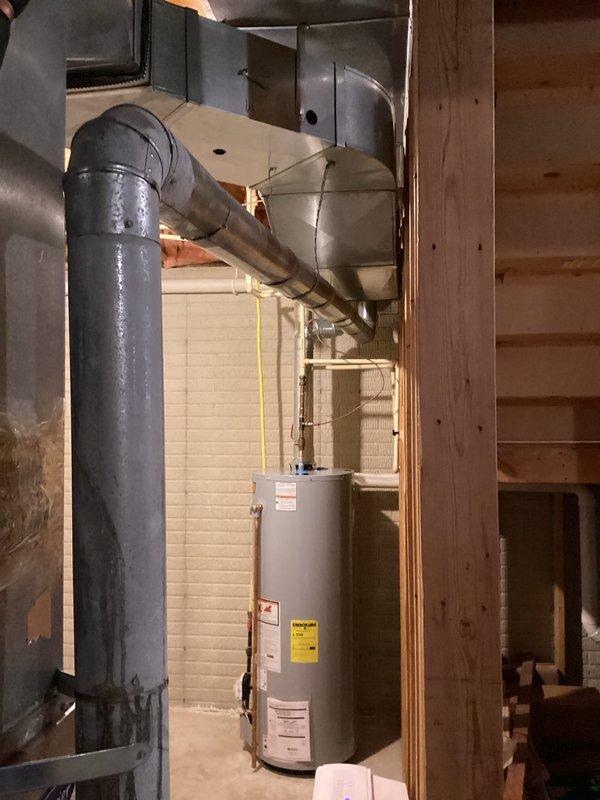 Completed on-site assessment of non-functional HVAC system at rental property for full replacement estimate. Evaluated existing furnace and central air conditioning unit, both originally installed in 2003, confirming equipment failure and end of serviceable life. Inspected basement mechanical room configuration, including existing ductwork, humidifier integration, PVC condensate drainage system, and electrical connections. Documented current system specifications, clearances, and installation conditions through photographic survey. Assessed structural requirements for replacement equipment installation, including adequate access, ventilation, and code compliance considerations. Provided homeowner with comprehensive replacement options focused on standard efficiency equipment suitable for rental property application, emphasizing cost-effective and reliable solutions with manufacturer warranties. Reviewed available utility rebate programs and current promotional offers to maximize value.