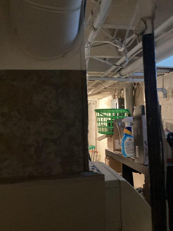 Conducted comprehensive assessment of residential HVAC system in basement utility area to provide full system replacement estimate. Evaluated non-operational air conditioning unit and currently functional furnace system, documenting existing equipment configuration, ductwork layout, electrical connections, and installation requirements. Photographed equipment location and surrounding mechanical space to determine specifications for new AC and furnace installation.