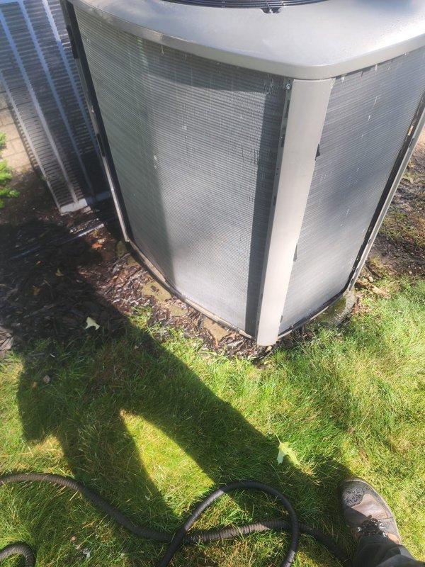Completed comprehensive air conditioning tune-up on residential cooling system with outdoor condenser unit located in backyard. Performed standard preventive maintenance procedures including inspection of compressor assembly, electrical connections, and condenser coil condition. All components found to be operating within normal parameters, with unit showing typical wear for age and maintaining proper functionality for continued seasonal operation.