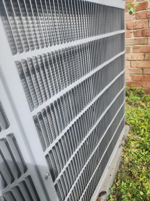 Completed preventative maintenance on residential air conditioning system under Worry Free Service Agreement. Performed comprehensive inspection of outdoor condenser unit, including examination of cooling coils, condensate drain pan, and refrigerant lines. Coils found in satisfactory condition with adequate airflow through fins. Drain pan showing normal operational wear with minor residue accumulation but remains functional. All components operating within normal parameters at time of service.