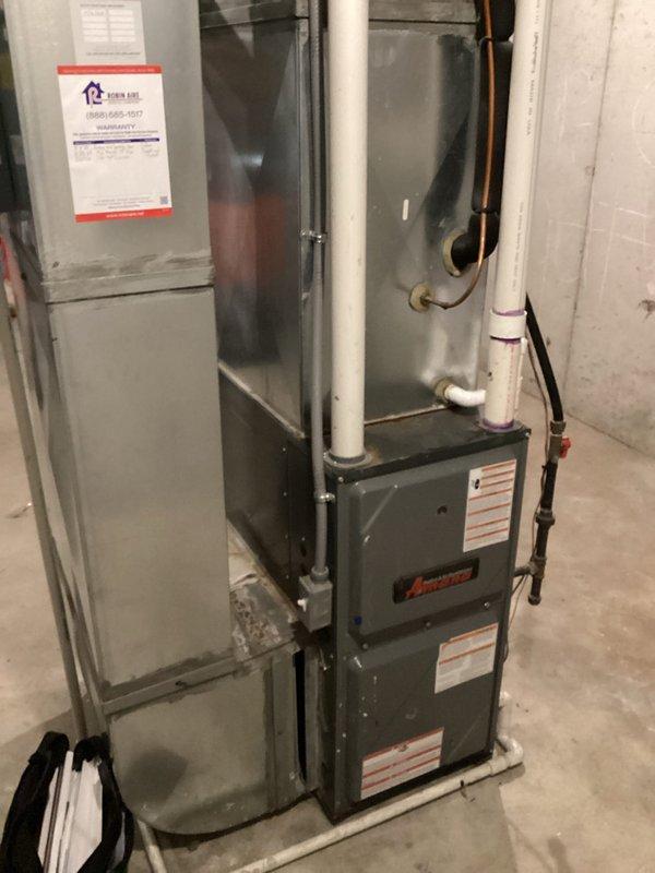 Completed estimate for air conditioning system replacement on existing HVAC installation in basement mechanical room. Current AC unit is operational but nearing end of service life based on previous repair technician recommendation. Evaluated existing furnace, ductwork configuration, refrigerant line routing with purple insulation, and PVC venting system to determine compatibility requirements for new equipment. Documented current system specifications including air handler setup, electrical connections, and clearance dimensions for replacement unit sizing. Provided homeowner with comprehensive replacement options and discussed potential to apply previous repair costs toward new system installation.