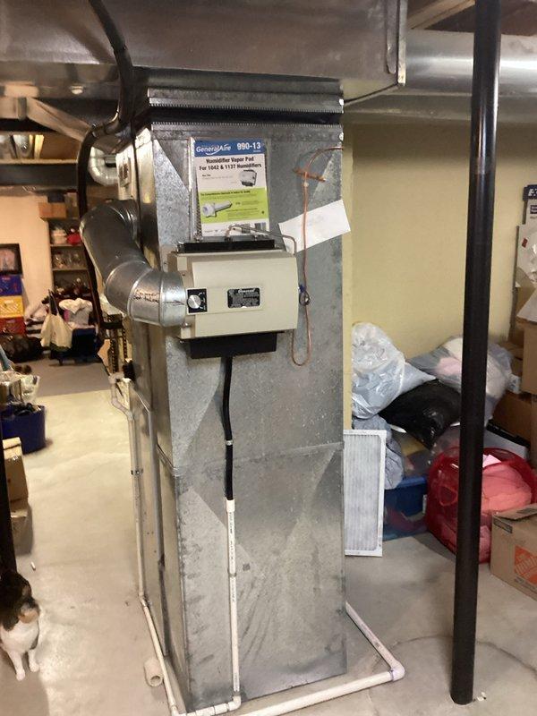 Provided comprehensive estimate for complete HVAC system replacement in basement installation, including non-operational air conditioning unit originally installed in 1997. Assessed existing vertical furnace configuration with galvanized ductwork, evaluated equipment accessibility and replacement requirements, and documented current system layout including ductwork connections and clearance specifications. Coordinated follow-up diagnostic service visit to determine repair viability versus full system replacement options.