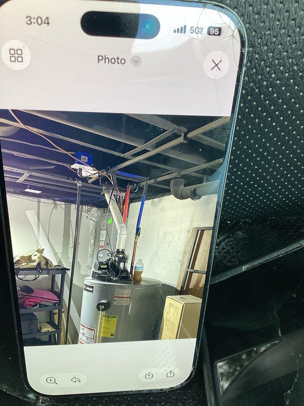 Documented existing HVAC system and water heater installation in basement utility room. Photographed current equipment layout, ductwork configuration, and mechanical room conditions to support replacement estimate preparation.