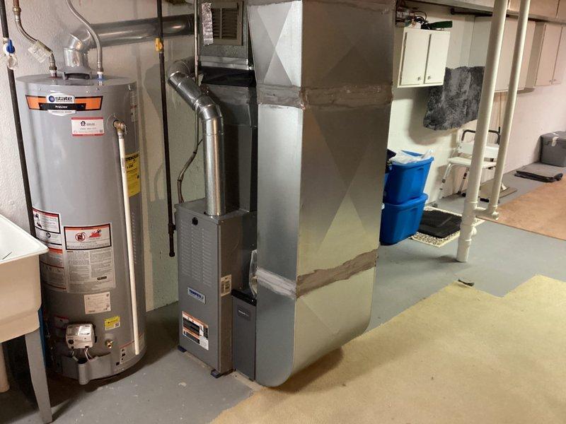 Completed installation of new Lennox air conditioning system in residential basement mechanical room. Unit was properly connected to existing furnace and ductwork, with all electrical and refrigerant lines installed per manufacturer specifications and local code requirements.