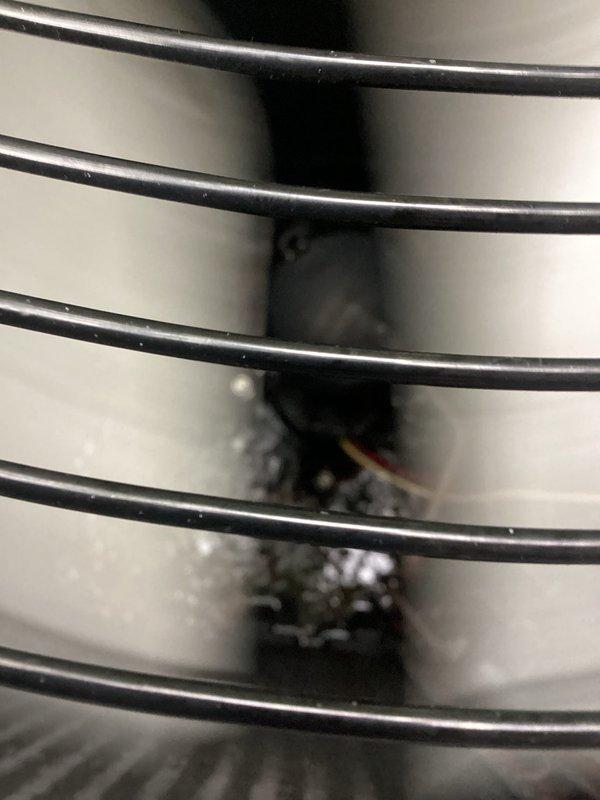 Responded to service call for insufficient cooling on second floor and system inspection following basement renovation. Performed comprehensive system evaluation including inspection of outdoor condenser unit and indoor air handler components. Examined condenser unit exterior condition, verified proper airflow through grille openings, and assessed surrounding area for debris or vegetation interference. Inspected indoor air handler assembly including blower motor, fan cage, and internal components for proper operation. Checked and evaluated air filter condition as part of post-renovation assessment. System components found to be operational with minor maintenance recommendations provided to customer.