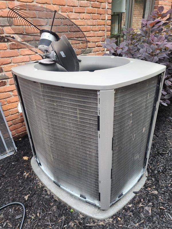 Completed routine AC Maintenance 5-7 on residential outdoor condensing unit. Performed standard inspection of condenser coil, fan motor assembly, refrigerant lines, and drain pan. Interior components showed normal operational wear with minor rust staining in drain pan and typical outdoor weathering on cabinet surfaces; all equipment functioning within normal parameters.