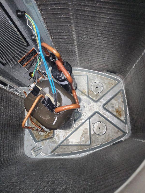 Completed routine AC Maintenance 5-7 on residential outdoor condensing unit. Performed standard inspection of condenser coil, fan motor assembly, refrigerant lines, and drain pan. Interior components showed normal operational wear with minor rust staining in drain pan and typical outdoor weathering on cabinet surfaces; all equipment functioning within normal parameters.