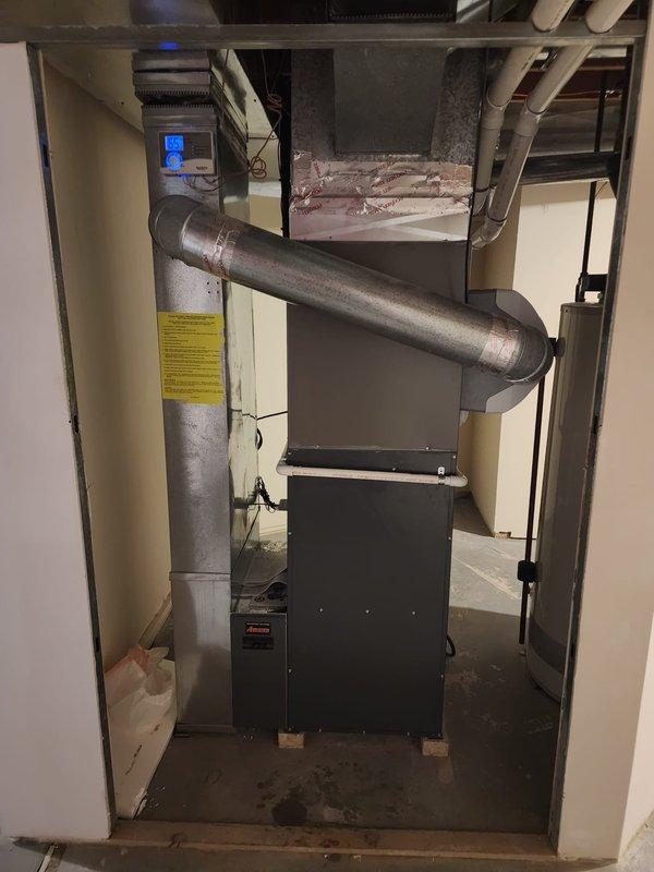 Completed installation of Lennox air conditioning system at residential property. New AC unit was professionally installed, connected to existing furnace and ductwork infrastructure, with all refrigerant lines, electrical connections, and condensate drainage properly configured and tested for optimal performance.