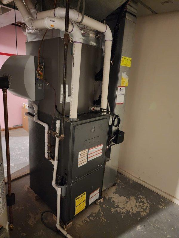 Completed installation of Lennox air conditioning system at residential property. New AC unit was professionally installed, connected to existing furnace and ductwork infrastructure, with all refrigerant lines, electrical connections, and condensate drainage properly configured and tested for optimal performance.