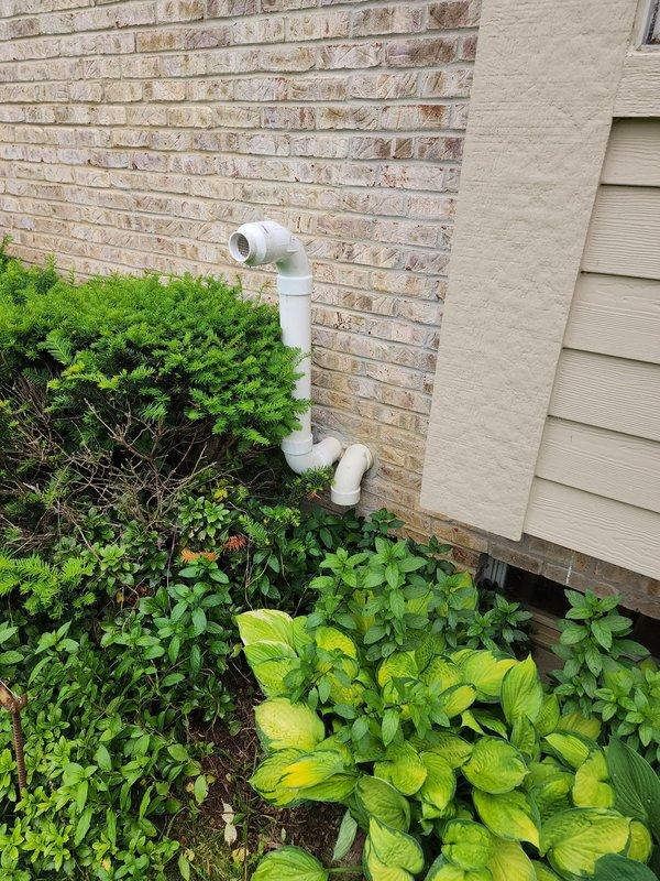 Completed full HVAC system installation including Lennox furnace air handler, air conditioner condenser unit, and T6 programmable thermostat. Installed indoor air handler in basement utility area with proper refrigerant line connections, condensate drainage system using white PVC piping, and integrated ductwork connections. Positioned outdoor condenser unit at building exterior with appropriate clearances from structure and landscaping, ensuring proper drainage and ventilation access.