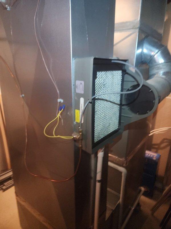 Replaced defective plastic humidifier supply line (8-12 size) on residential HVAC air handler unit. Removed old tubing, installed new line with proper routing and connections, and verified system operation upon completion.