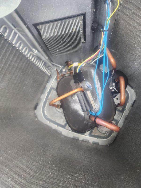 Responded to service call for AC unit making loud noises and experiencing high amp draw. Upon inspection, found compressor showing signs of moisture accumulation and visible condensation on components, indicating potential operational stress. Performed system evaluation of evaporator coil, refrigerant lines, and electrical connections; all appeared intact with proper wire terminations. Cleaned air handler grilles which showed dust accumulation that could restrict airflow and contribute to increased amp draw. Recommended full maintenance service to address underlying issues causing excessive noise and high amperage readings, as immediate repair could not be completed during this visit.