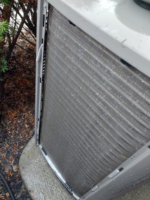 Completed preventive maintenance service on residential outdoor air conditioning condenser unit under Worry Free Service Agreement. Performed comprehensive system inspection including visual assessment of condenser coil assembly, which showed moderate accumulation of dirt and debris between aluminum fins but remained structurally sound with no bent fins or damage observed. Unit housing exhibited normal weathering consistent with outdoor exposure. Condenser coil operational and maintaining proper airflow capacity. System operating within normal parameters upon completion of scheduled maintenance protocol.