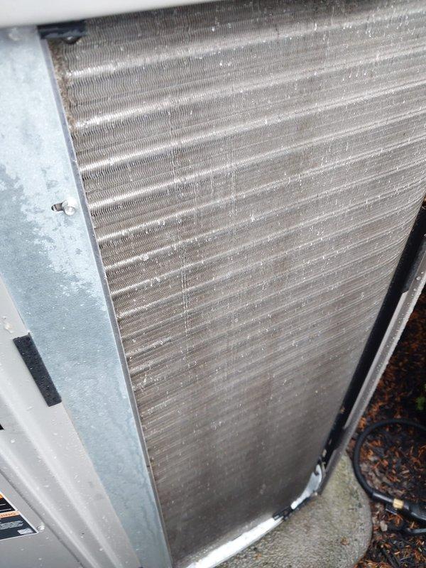 Completed preventive maintenance service on residential outdoor air conditioning condenser unit under Worry Free Service Agreement. Performed comprehensive system inspection including visual assessment of condenser coil assembly, which showed moderate accumulation of dirt and debris between aluminum fins but remained structurally sound with no bent fins or damage observed. Unit housing exhibited normal weathering consistent with outdoor exposure. Condenser coil operational and maintaining proper airflow capacity. System operating within normal parameters upon completion of scheduled maintenance protocol.