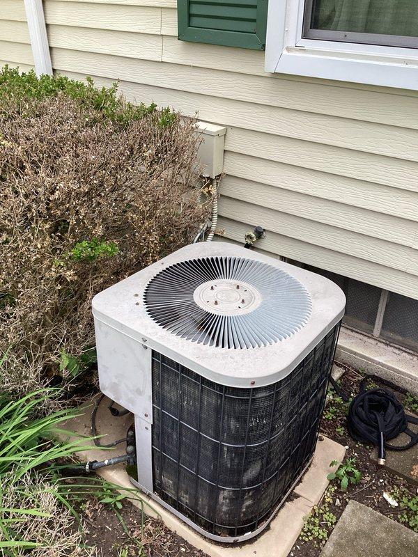 Provided estimate for replacement of 29-year-old residential air conditioning system currently operational but nearing end of service life. Evaluated existing outdoor condenser unit installed on concrete pad with refrigerant lines running to interior air handler. Documented equipment condition, discussed replacement options and system specifications appropriate for home's cooling requirements.
