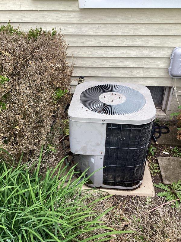 Provided estimate for replacement of 29-year-old residential air conditioning system currently operational but nearing end of service life. Evaluated existing outdoor condenser unit installed on concrete pad with refrigerant lines running to interior air handler. Documented equipment condition, discussed replacement options and system specifications appropriate for home's cooling requirements.