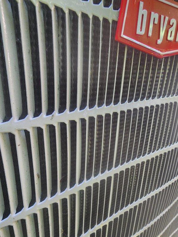 Completed scheduled AC maintenance on Bryant air conditioning system. Connected refrigerant manifold gauges to outdoor unit and recorded system operating pressures and temperatures, with readings showing 110.5°F on high side and 28.5°F on low side. Inspected indoor evaporator coil and found light dust accumulation on vertical fins; coil remains in serviceable condition with no significant blockage or damage noted. System operating within normal parameters at time of service.