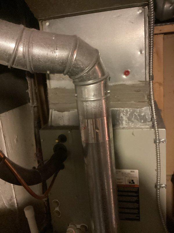 Completed HVAC estimate for replacement of 11-year-old American Standard air conditioning system that was failing to maintain desired temperature setpoint, with indoor temperature remaining at 75°F despite thermostat set to 70°F. Evaluated existing equipment including outdoor condensing unit located between porch and neighboring property, as well as indoor air handler and associated ductwork in basement utility area. Previous technician had recommended full system replacement due to repair costs exceeding value of aging equipment. Documented current system configuration, photographed air handler installation with supply plenum connections and drain line routing, and assessed compatibility requirements for replacement equipment installation.