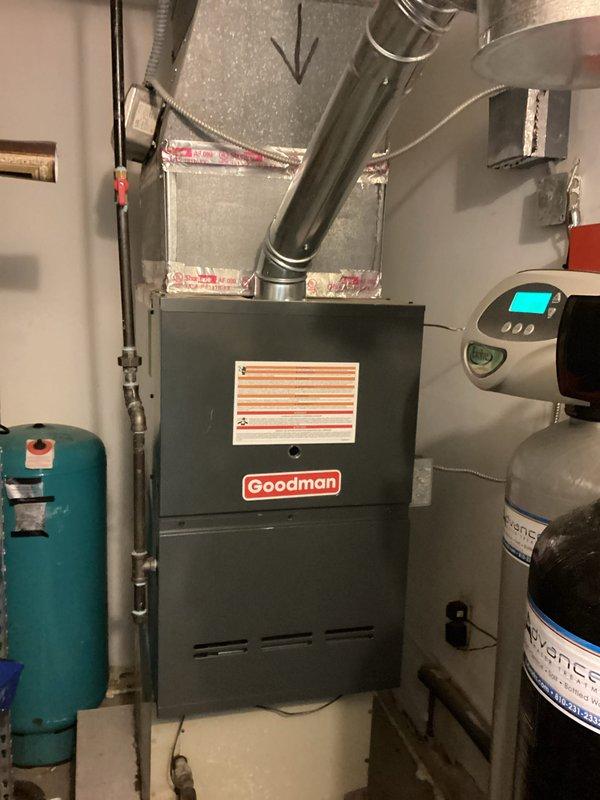 Completed estimate for air conditioning system replacement on a 1988 unit showing inadequate temperature differential despite producing cold air. Assessed existing Goodman furnace installed in February 2024, documented basement mechanical room configuration including ductwork connections, and provided replacement options for the aging AC system.