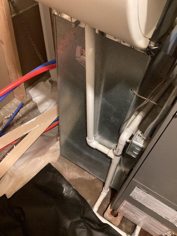 Conducted comprehensive evaluation of 15-year-old air conditioning and furnace system located in basement, both units non-operational. Assessed existing HVAC equipment configuration including air handler, ductwork connections, and associated mechanical components. Documented current system layout with photographic evidence showing metallic air handler with galvanized duct connections, foil-insulated ductwork with sealed joints, and filter access panel. Evaluated utility space infrastructure including PEX water supply lines, PVC plumbing, and equipment mounting systems. Provided detailed replacement estimate for complete HVAC system upgrade to restore heating and cooling functionality to the residence.